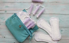 Bag with cotton tampons and sanitary pads. GettyImages/Isabel Pavia
