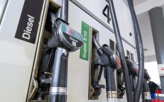 File: Fuel nozzles hang in the holder at a filling station. Peter Kneffel/dpa via AFP