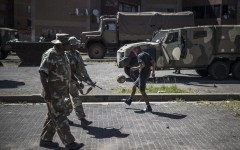  soldiers patrol a residential complex in Westbury, Johannesburg. AFP/Marco Longari