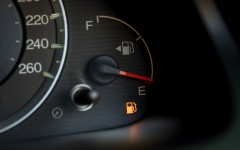 Empty fuel warning light in car dashboard. GettyImages/kckate16