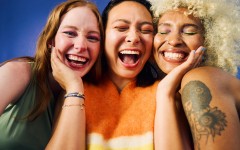Three women laughing together. GettyImages/pixdeluxe