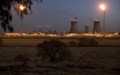 A Sasol coal-to-liquid fuel plant stands at dusk on July 7, 2008 in Secunda, South Africa