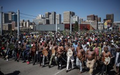 Protestors walk on a street during a protest march against undocumented migrants organised by “March and March” in Johannesburg on April 29, 2026.