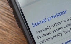 The words 'sexual predator' seen on a phone. GettyImages/Abu Hanifah