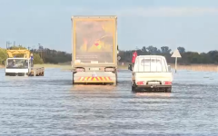 Vehicles stuck in flood waters.