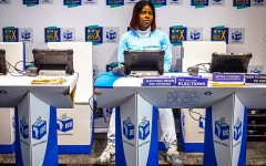An official sits at a voter registration table at the launch event for the 2026 Municipal elections. Per-Anders Pettersson/Getty Images