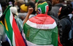 Protesters chant slogans as they march during a demonstration by the "March and March" and Operation Dudula movements. AFP/Rodger Bosch