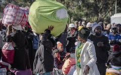 File: A group of Malawian undocumented migrants gather in front of the Malawian Consulate building to prepare for their return home. Ihsaan Haffejee/Anadolu via Getty Images