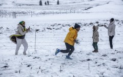 A family gathers to play in snow on Nottingham Road near Pietermaritzburg on 10 August. Photo by RAJESH JANTILAL / AFP