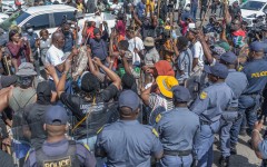 Protestors from the anti-illegal immigration group, March and March Movement chant slogans outside the Department of Home Affairs Refugee Reception Centre during a demonstration at the Che Guevara Road in Durban, on October 8, 2026.