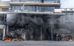 Cars are set alight after clashes erupt between protesters and foreign nationals in Durban on October 8, 2026.