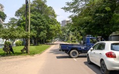 The Congolese Republican Guard and police block a road around the scene after the army said it had thwarted an attempted coup in the capital Kinshasa