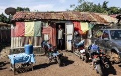 A man stands at the door of a makeshift cafe in Conakry's Yattaya T6 suburb, where young people who spoke to AFP had gathered
