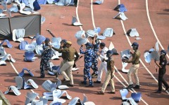 Disappointed fans pelted security officials with chairs ripped from the stadium