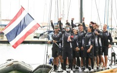 This pool photo taken and released on December 18, 2025 shows Thailand's Queen Suthida (C) celebrating with her team