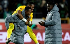 Nigeria reserve goalkeeper Amas Obasogien carries Stanley Nwabali, who saved two penalties in a shoot-out victory over Egypt in the Africa Cup of Nations third place play-off.