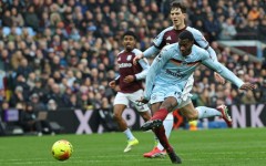 Brentford striker Dango Ouattara shoots against Aston Villa