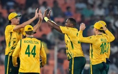 South Africa's Lungi Ngidi (C) celebrates with teammates after taking the wicket of Canada's Yuvraj Samra