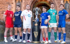 Wales' Dewi Lake, Scotland's Sione Tuipulotu, England's Jamie George, France's Antoine Dupont, Ireland's Caelan Doris, and Italy's Michele Lamaro pose with the trophy in January before the accident