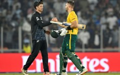 Aiden Markram (right) is congratulated by New Zealand counterpart Mitchell Santner after South Africa won their group phase clash in Ahmedabad on February 15