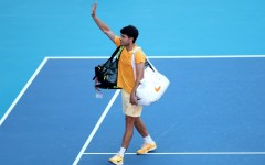 Early exit: World number one Carlos Alcaraz waves to fans after falling to 36th-ranked Sebastian Korda in the third round of the Miami Open