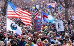 Demonstrators take part in the 'No Kings' national day of protest in West Bloomfield, Michigan, a suburb of Detroit