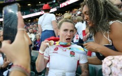 England centre Megan Jones (L) celebrates after their 33-13 Women's Rugby World Cup final win over Canada at Twickenham last year