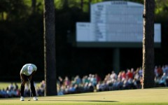 World number one Scottie Scheffler reacts after a missed putt on the 15th green during the first round of the 90th Masters