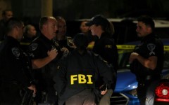 FBI agents are seen outside a residence associated with the alleged White House Correspondents' Dinner shooter in Torrance, California, on April 25, 2026