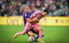 Inter Miami's Argentine forward, Lionel Messi, vies for the ball against Orlando City's Swedish defender Robin Jansson