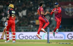 Prince Yadav (C) celebrates with Lucknow Super Giants team-mate Digvesh Rathi after dismissing Virat Kohli (L)