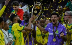 Keanu Cupido (L) and captain Ronwen Williams hold the CAF Champions League trophy after winning the final against FAR Rabat.