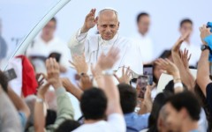 Pope Leo XIV greets the crowd as he arrives to attend a prayer vigil at the Olympic Stadium in Barcelona on June 9