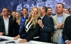 SpaceX president and chief operating officer Gwynne Shotwell (C) celebrates with SpaceX employees and executives