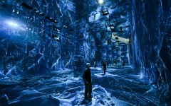 Attendees interact with immersive visualizations from the inaugural exhibition Machine Dreams: Rainforest are projected at DATALAND, the Museum of AI Arts