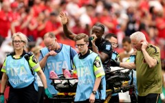 Canada's Ismael Kone waves to the crowd after suffering a serious injury in the 6-0 win over Qatar