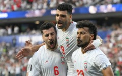 Iran players celebrate after scoring during their first World Cup match, a 2-2 draw against New Zealand in Los Angeles
