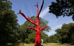 The "Climate Changed Oak Tree" was painted red after dying in the drought of 2022 stands in Kew Gardens, west London