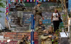 Brazilian special police forces patrol a street during an operation in the Santa Marta favela