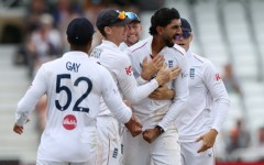 England off-spinner Shoaib Bashir (2R) celebrates with teammates after trapping New Zealand's Rachin Ravindra lbw in the third Test at Trent Bridge