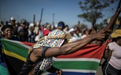 Protests have been fronted by men carrying sticks and shields