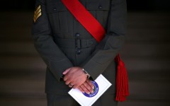 A member of the military stands guard on the first day of the 2026 Wimbledon Championships