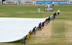 Ground staff pull on the covers during the fifth and final day of the second Test between Sri Lanka and West Indies
