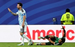Argentina forward Lionel Messi gestures after fouling Algeria's Aissa Mandi, which pundits say should have earned him a red card