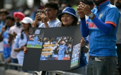 India fans watch as the team take to the field before the start of the first one-day international (ODI) cricket match against England at Edgbaston in Birmingham, central England