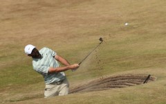 Scottie Scheffler plays from a bunker during practice for the British Open at Royal Birkdale