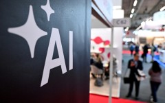 People walk past a banner for AI at the 2024 Frankfurt book fair