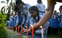 Mourners and students at Small Heaven School in Chitwan light candles after the death of mountaineer Nirmal Purja and his companions in an avalanche in Pakistan