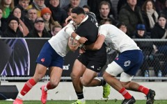 New Zealand hooker Codie Taylor (C) is tackled during a 2025 Test against France in Dunedin.