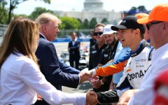 US President Donald Trump and First Lady Melania Trump, at left, greet IndyCar drivers before the start of the Freedom 250 Grand Prix on the streets of Washington